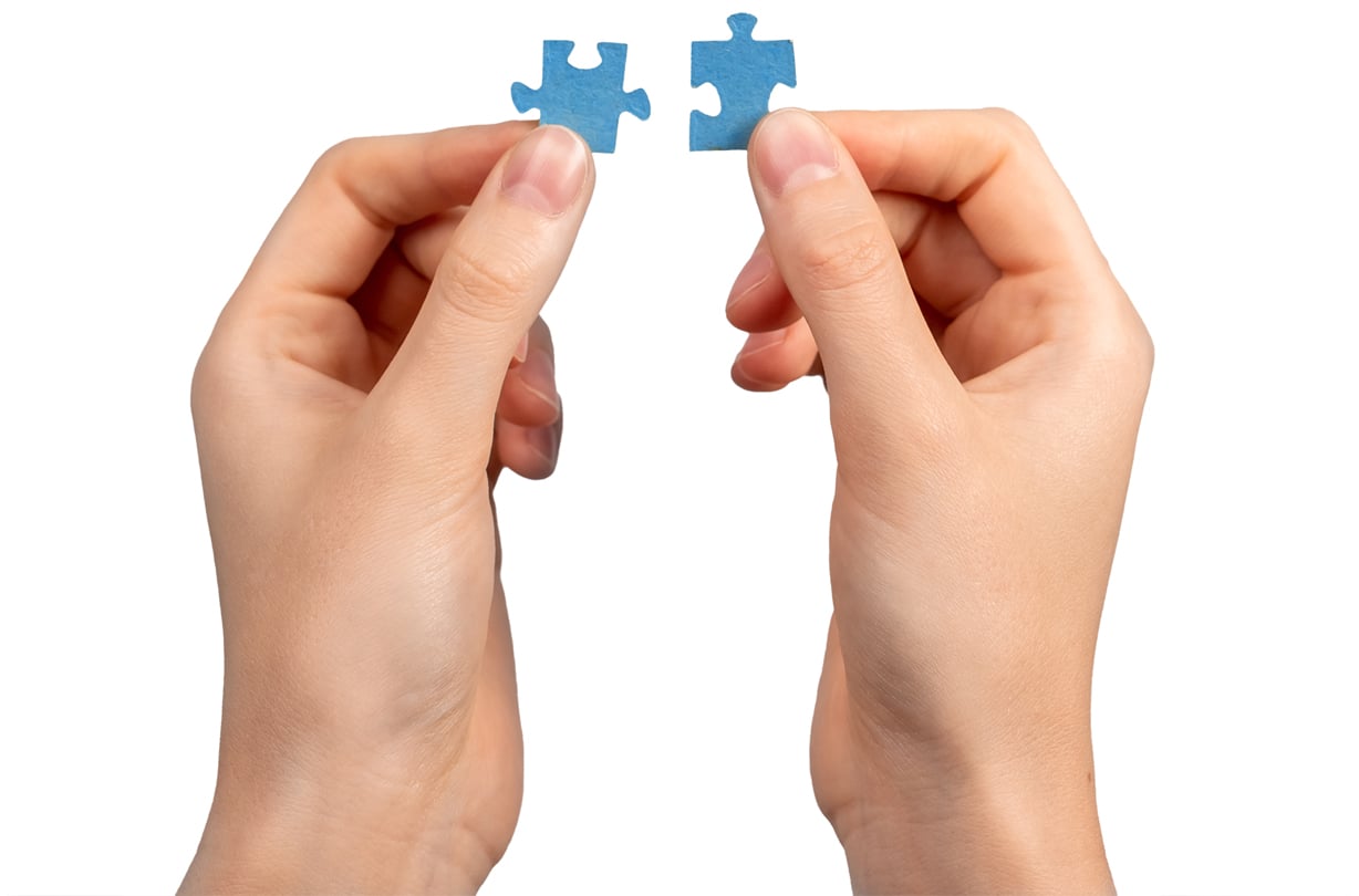 head_pages_our_partners image_depicting_hands_alligning_puzzle_pieces